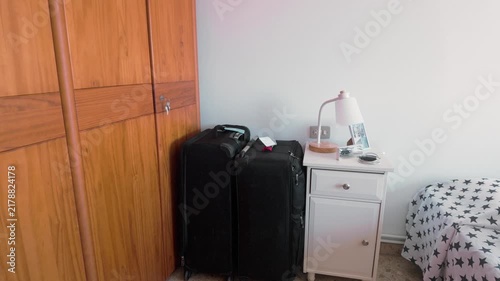 Packed trolley luggage bags waiting inside a bedroom for a journey