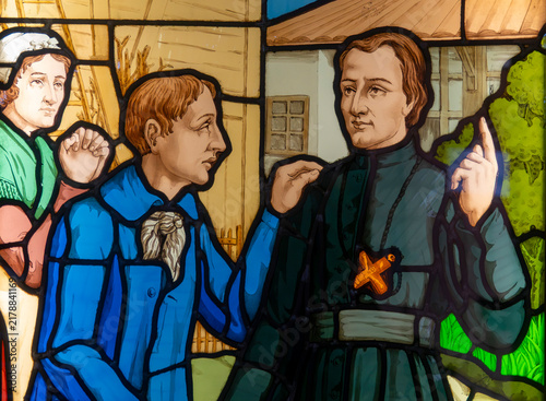 Konstfotografi Stained glass of Saint Peter Chanel with villagers.