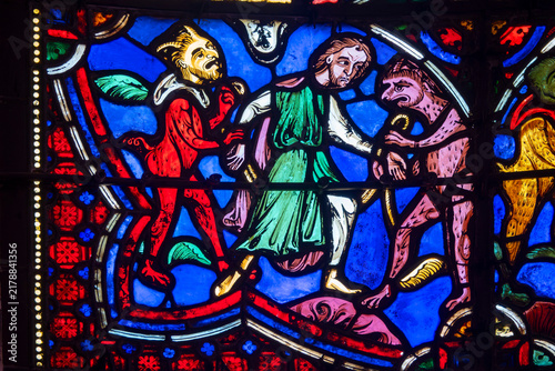 фотографія Saint John surrounded by demonic creatures in an Apocalypse stained-glass window