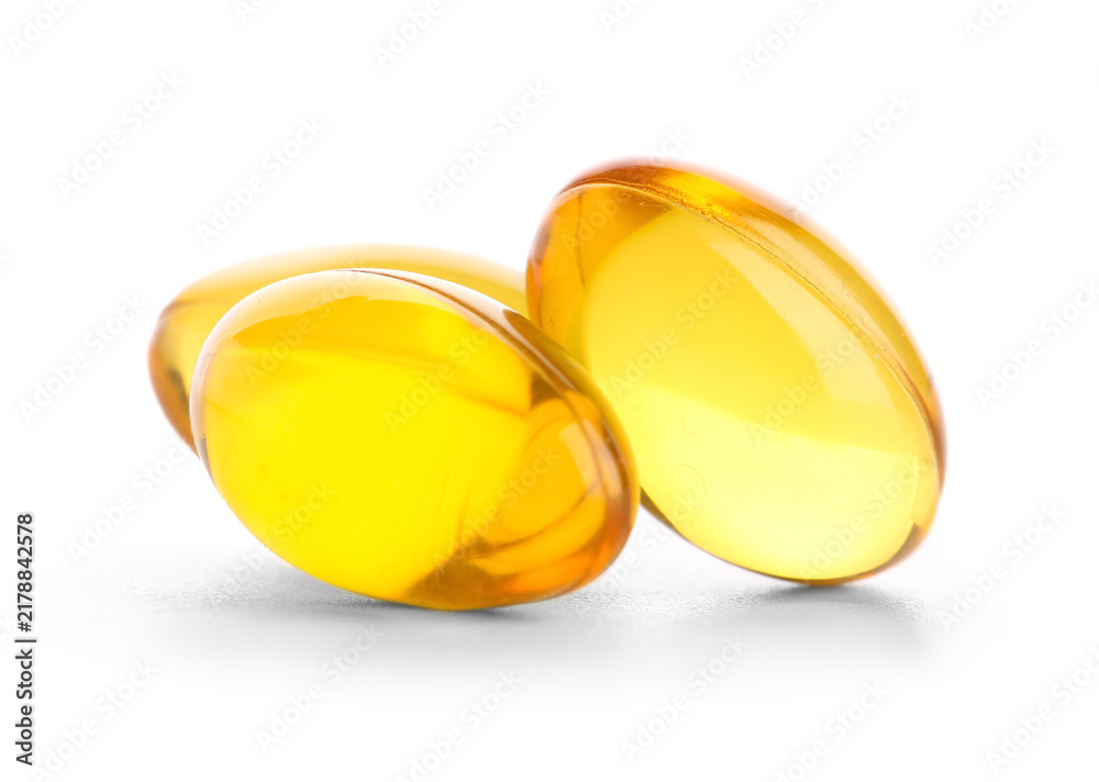 Obraz premium Nutritional supplement and wellness, yellow omega 3 fish oil capsules for health and dietary support isolated on a clean white background