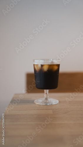 Cuadro en lienzo Iced Coffee in Stemmed Glass on Table Vertical