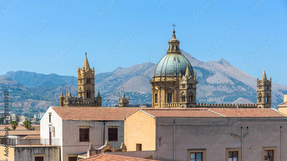 Fototapeta premium Dome and towers of Palermo Cathedral against Monte Cuccio