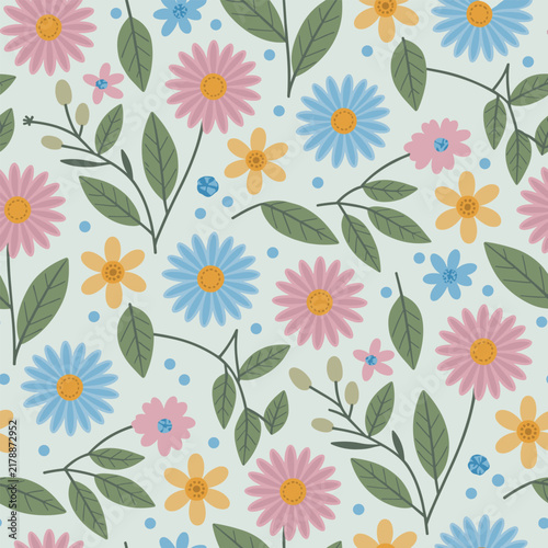 Seamless floral pattern with colorful daisies and green leaves on a light pastel background
