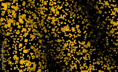 Abstract golden particles and sparkling dust on a dark black background, creating an elegant glowing texture