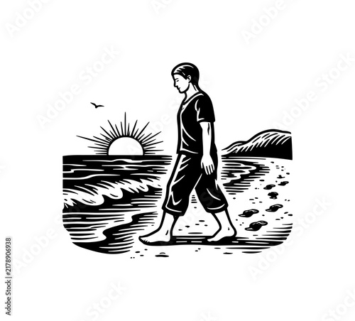 Person walking barefoot on a beach at sunrise leaving footprints in the sand