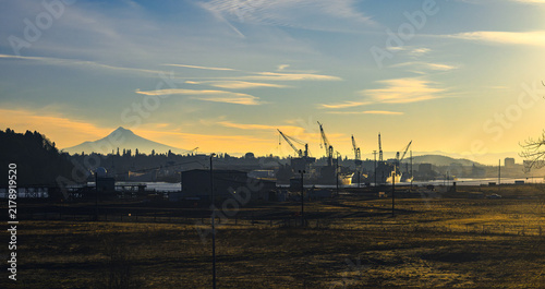 Bild auf Leinwand Mount Hood Above an Industrial Shipyard Waterfront at Golden Hour