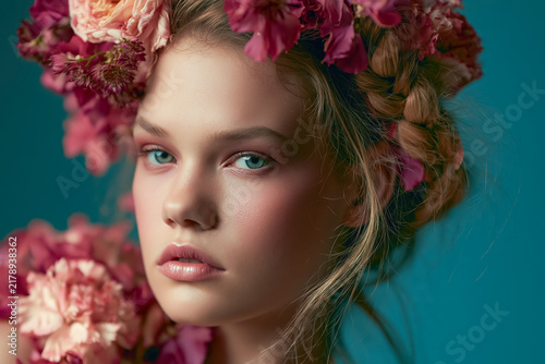 Fototapeta Female portrait with floral crown and colorful artistic design elements creating a vibrant fashion illustration style composition.