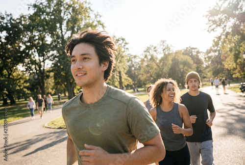 Diverse Friends Jogging Together in Sunny Public Park, Healthy Active Lifestyle and Outdoor Fitness Snapshot with Copy Space