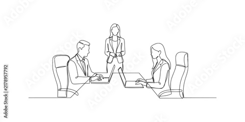 Continuous line drawing of business people working together in an office meeting with laptops and a standing leader