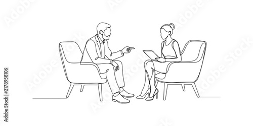 Business man and woman sitting in chairs having a professional meeting and talking