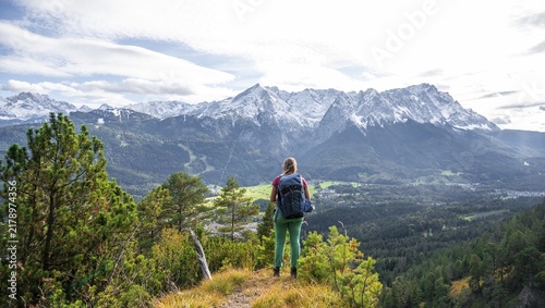 Young hiker on the trail to the Kramer, Wetterstein Mountains at the back, Garmisch, Bavaria, Germany