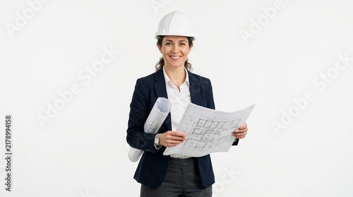 Professional woman in hard hat holding blueprints on white background