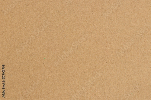 Brown cardboard sheet abstract background, texture of sepia color kraft paper with vintage pattern for design art work.