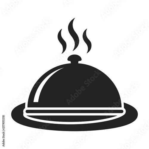 Black and white cloche with steam rising from top on plate serving food