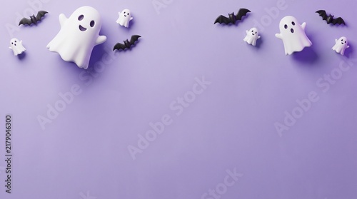 Halloween background with cute ghosts and bats on a purple surface for holiday design