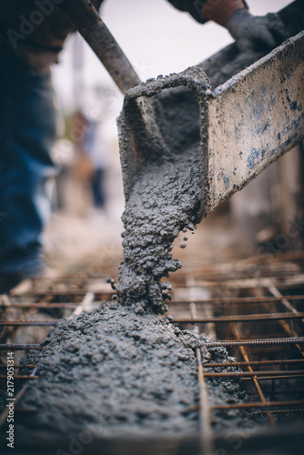 Flowing Cement into Construction Form for Strong Building Foundations