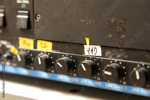 Foto Control panel with knobs and switches showing labels for different audio setting