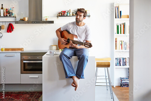 Canvastavla Thinking, man and guitar in home for playing music, practice chords and performance rehearsal