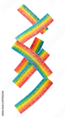 Falling rainbow sour candy strips isolated on transparent background