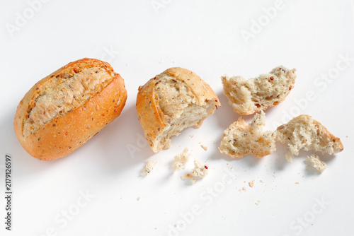 Whole grain bread bun broken