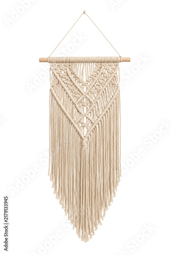 Fotografie Beautiful handmade beige macrame wall hanging with intricate knot patterns on a