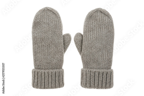 Fotografie Pair of warm, cozy, gray knitted mittens with ribbed cuffs is presented on a cle
