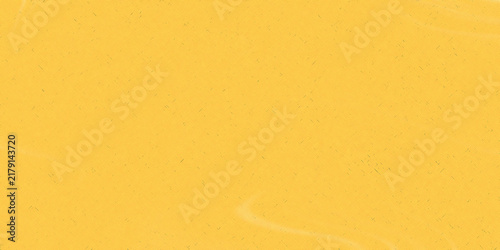 Abstract yellow background, featuring a soft, grainy texture with, subtle flowing liquid, wave patterns and, light gradients across surface