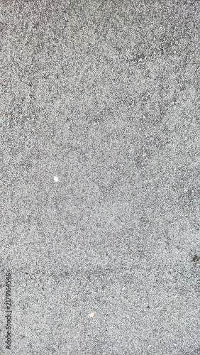 Bild auf Leinwand Grey asphalt pavement with subtle texture and minor imperfections