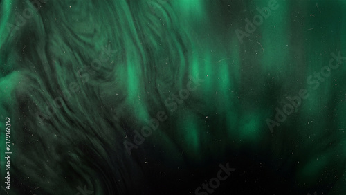 Abstract green aurora swirling light background