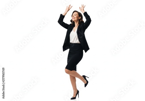Woman jumping in joy wearing business suit and high heels