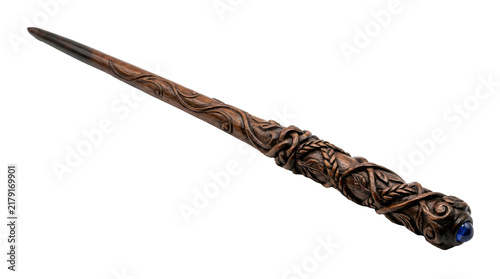 Fotografie Carved wooden magic wand featuring intricate twisted leaf patterns and a glowing