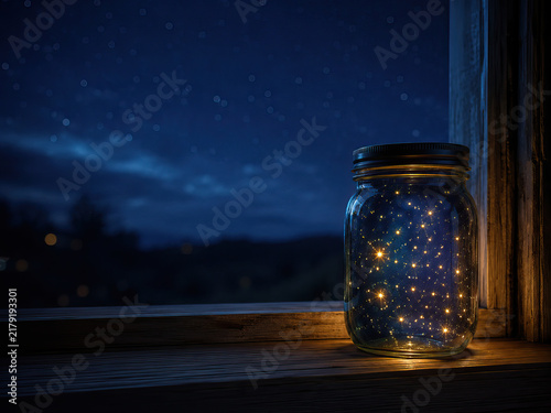 Realistic photograph that captures a serene night scene. It features a clear glass jar filled with numerous small, bright stars scattered throughout its interior.