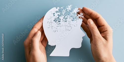 Elderly memory loss and dementia concept with scattering puzzle inside paper head profile, world alzheimers day