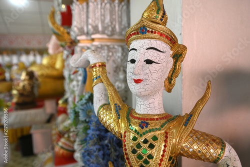 Canvastavla A close-up of a traditional Thai angelic statue with an ornate golden costume an