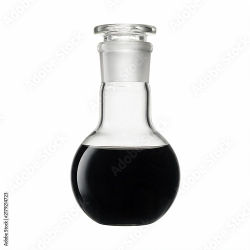 A clear glass laboratory flask filled with a dark liquid isolated on a white background with fresh pressed elixir opaque liquid sits against round glass