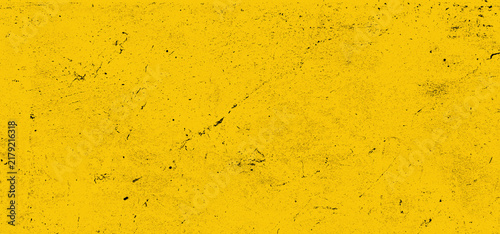 Abstract bright yellow wall or concrete texture with rough scratches for creative design