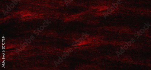 Dark red and black grunge background texture with rough chalk or pastel brush strokes and distressed surface