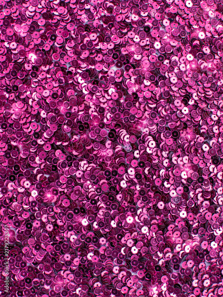 Obraz premium Bright magenta sequin fabric background texture
