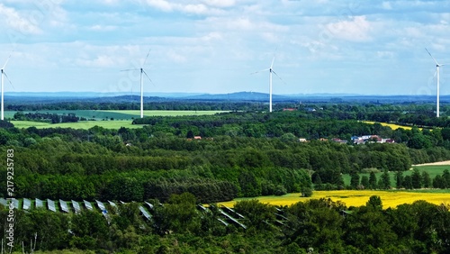 Quadro su tela Rural Landscape Solar Panels Wind Turbines Green Fields Sky