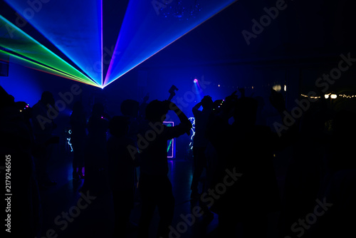 Unrecognizable people dancing in a nightclub