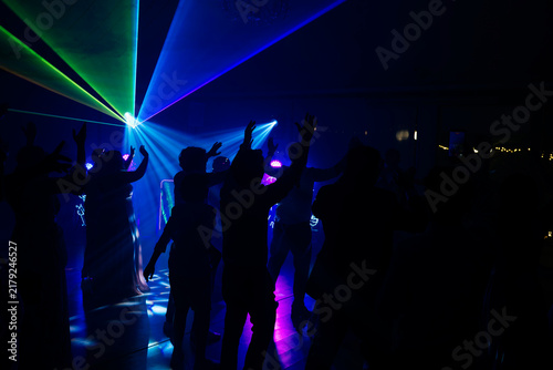 Unrecognizable people dancing in a nightclub