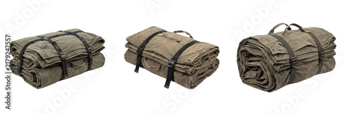Rolled canvas bedrolls with black utility straps camping blanket rolls tactical bed roll military style outdoor sleeping gear isolated on white background stock photo