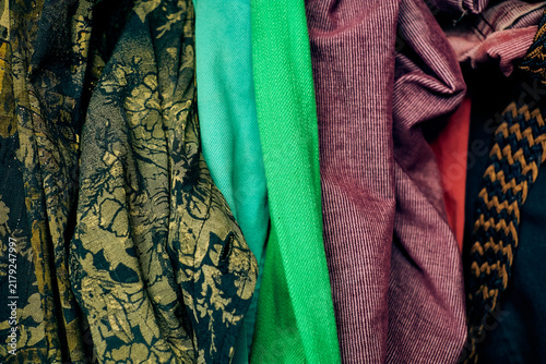 Home closet filled with casual clothes, jeans and shirts