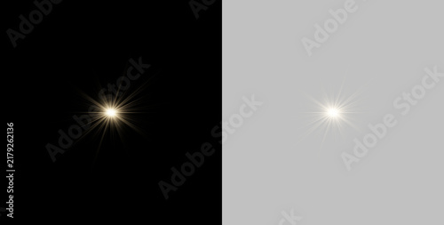 Bild auf Leinwand Two golden starburst light flares shine against a black background
