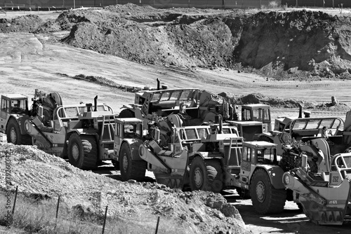 Quadro su tela Yellow machinery lines dusty construction site