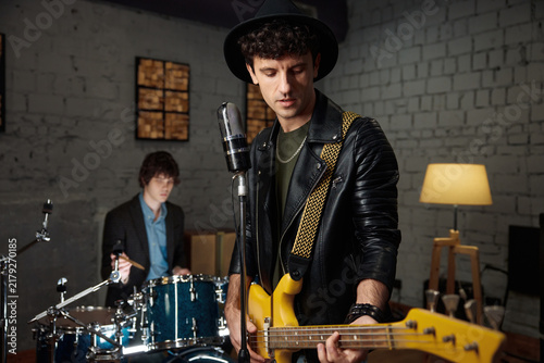 Принти на полотні Cozy studio session capturing melodic riffs with talented band ensemble