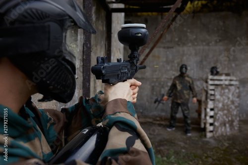 Cuadro en lienzo A portrait of a soldier taking a stance and aiming, ready to shoot at his oppone