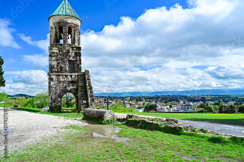 Medieval Bagrati Cathedral with a green domed roof and bell tower on Ukimerioni Hill above the city of Kutaisi, Imereti region, Georgia