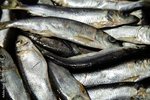 Obraz na płótnie Fresh baltic herring fish close up on dark background