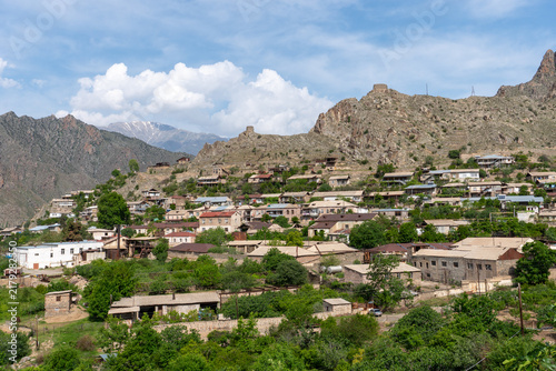 Village houses below rocky mountains in Meghri, Armenia